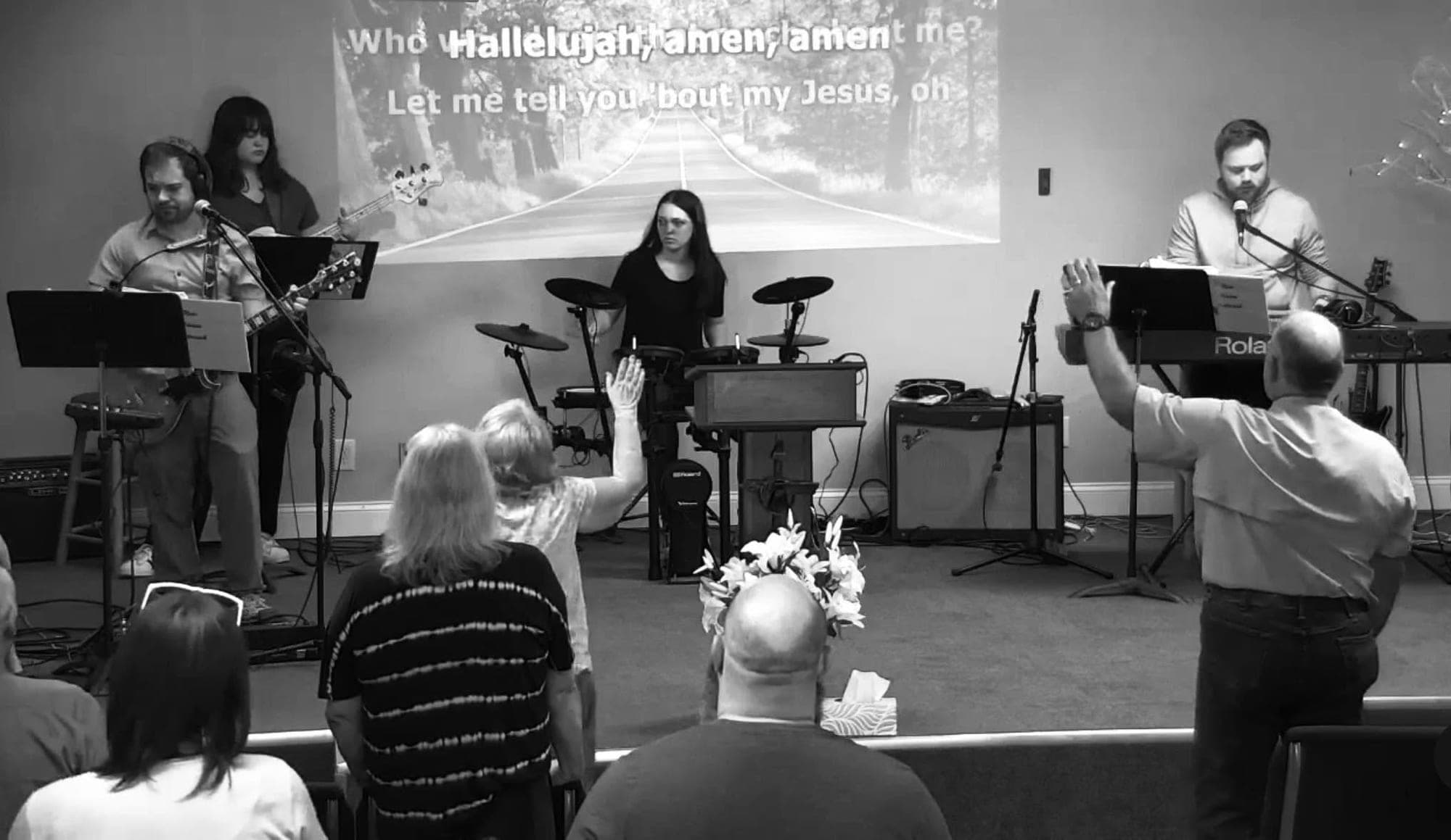 The New Vision worship band leading Sunday worship as the congregation raises their hands